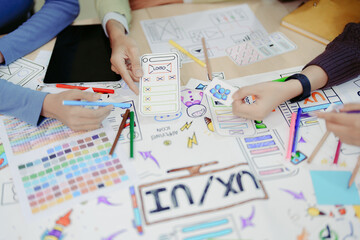 Wall Mural - Team of Creative Web, Graphic Designer planning for mobile phone, drawing website ux ui app for mobile phone application and development template layout, process to developing prototype wireframe.
