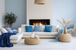 © Anna - Modern living room with fireplace. Cozy interior design with blue, white and beige colors