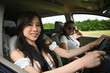 © Prathankarnpap - Pretty young women having fun together driving by countryside. Road trip, traveling and lifestyle concept