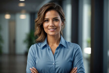Happy young smiling confident professional business woman wearing blue shirt, pretty stylish female executive looking at camera, standing arms crossed isolated at gray background, Generative AI