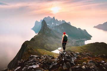 Wall Mural - traveler woman hiking solo in mountains of norway outdoor activity travel summer vacations healthy l