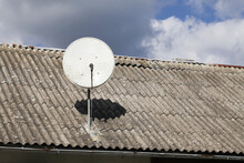 Tile Roof Antenna Background. TV Satelite Dish Old House Roof. Countryside Village Architecture Rooftop Satelite. Television Antenna Mount.
