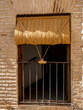 © xavicore - Balcón con una persiana de esparto