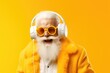Cool funny Santa Claus listening music in headphones isolated on yellow bright background. Nightclub invite on christmas party celebration funky grandfather