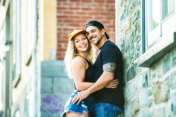 Sticker - Beautiful couple having fun outdoors on urban background