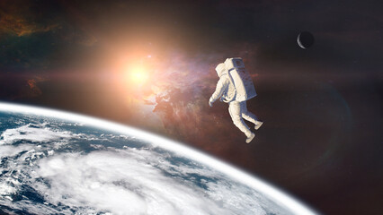 Wall Mural - spaceman on low-orbit of earth planet with sun light. elements of this image furnished by nasa.