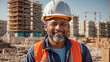 © tanya78 - Portrait of a male builder in a hard hat on a construction site background
