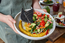 Healthy Organic Vegan Food Being Held By Waiter