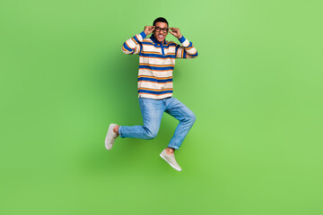 Sticker - Full body photo cadre of jumping high trampoline air touching new spectacles guy perfect eyesight store isolated on green color background