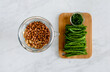 © Austockphoto - Green beans on chopping board and strainer with legumes