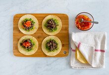 Tortillas On Chopping Board With Salsa