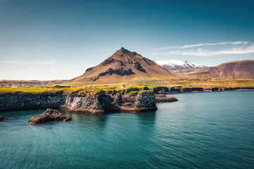 Poster - Arnarstapi fishing village with nordic house and stapafell mountain on coastline in Snaefellsnes peninsula at Iceland