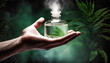 a man's hand holds a glass bottle with perfume, liquid, oil, vapor from a bottle, natural product, jungle forest around