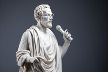 White Sculpture Of Demosthenes Wearing Glasses And A Microphone In His Hand. The Concept Of Public Speaking.