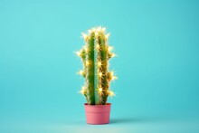 Creative Christmas Concept.  Homemade Cactus In Pink Pot With Lighted Christmas Garland On Blue Pastel Background.