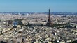 Aerial panoramic view of metropolis with Seine River and famous dominant tall structure of Eiffel Tower. Paris, France