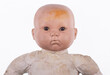 © serikbaib - old dirty baby doll portrait isolated on white background
