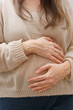 © Focalfinder - Pregnant woman holding her belly with hands