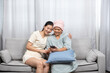 © yuttapon - The daughter is caring for her mother who is sick with cancer. with a smiling face I hope your mother gets better. Make a hat for mom because her hair is falling out.Please take care of health.