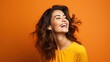 © Muzaffer Stock - Happy beauty woman in orange color