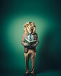 © Popovo - A male teacher in a suit with a lion head tie stands with an open book in hand, in a style with cheerful, bold, and vibrant colors.