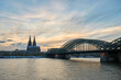 Panoramic view of the Rhine river at sunset as it passes through the city of Cologne in Germany.