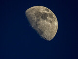 Fototapeta Do pokoju - High zoom of a moon near first quarter