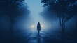 © Crane Design - woman walking alone down foggy road at blue hour