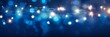 © Alona - Abstract Holiday Background. Glowing Christmas Garland Bokeh Lights in Dark Blue Illuminated Decoration