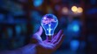 © MBRAMO - hand holding creative blue light bulb with technology network icon