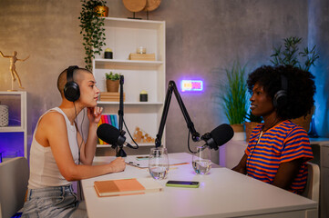 Wall Mural - A journalist is sitting in a home recording studio and going live on air