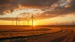 panorama of wind turbines at sunset