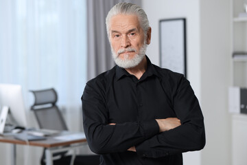 Sticker - Portrait of handsome senior man in black shirt at home