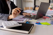 © David - Businessman working at office with documents on his desk, doing planning analyzing the financial report, business plan investment, finance analysis concept