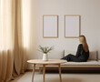 © piknine - Woman looking at blank frame painting mockup
