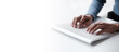 © Parichat - Businesswoman hands using laptop computer placed on desktop.