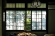 Dappled light falling across the paper screen windows of a traditional ryokan (guesthouse) on a sunny morning in Sengokuhara, Hakone - Kanagawa, Japan 