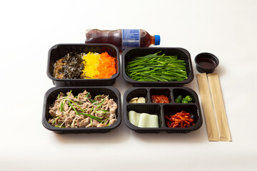 Wall Mural - Stir-fried meat and side dishes in packaging containers, Korean food