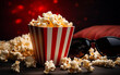 Close-up on pop corn with empty red theatre seats background
