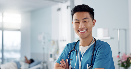 Wall Mural - Medicine, doctor and asian man with arms crossed at hospital with smile for support, service and wellness. Healthcare, professional or expert with happiness and pride for career, surgery or insurance