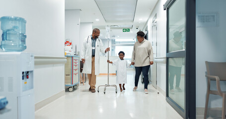 Sticker - Medical, pediatrician and a doctor walking with a black family in a hospital corridor for diagnosis. Healthcare, communication and consulting with a medicine professional talking to a boy patient