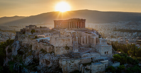 Wall Mural - A golden sunrise behind the ancient Parthenon Temple at the Acropolis of Athens, Greece