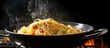 Removing cooked spaghetti from the pan using tongs steamy hot food close up With copyspace for text