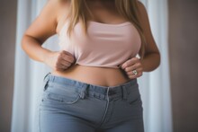 Photo Of Woman Checking Her Old Pants After Losing Weight