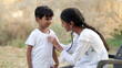 © Govind - Health checkup, Children medical insurance care. Indian young doctor of pediatrician holding stethoscope checking heartbeat