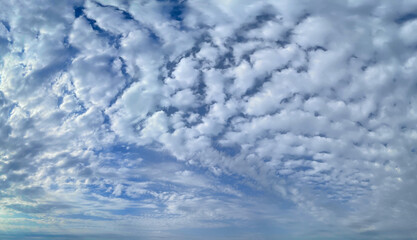 Wall Mural - white fluffy clouds floating on blue sky background