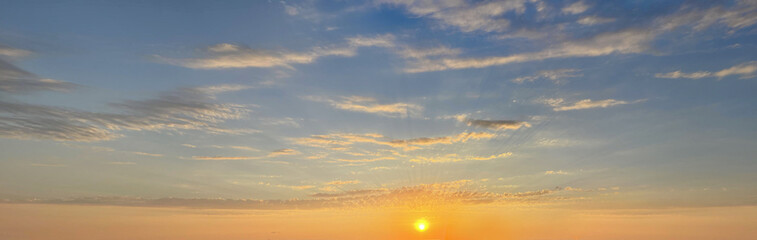 Wall Mural - sunset sun on golden sky with cloud. sunrise horison skyline background