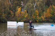 © WoodHunt - Girl on a wakeboard. An athlete performs a trick on the water. Autumn Park