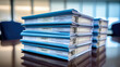 © Studio Nova - Stack of documents on the office desk.