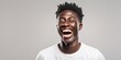 Handsome unshaven young dark-skinned male laughing out loud at funny meme he found on internet, smiling broadly, showing his white straight teeth. Positive human facial expressions and : Generative AI